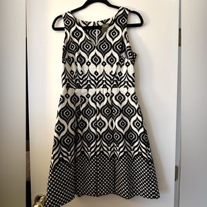 Patterned size 4 Taylor dress.  Pleated flair skirt and a fitted v-neck top.